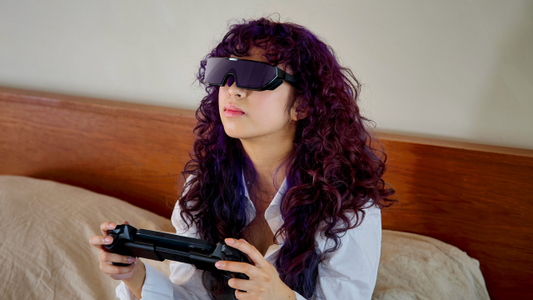Woman gaming with Sentinel XR Glasses and ELO Vagabond Mobile Gaming Controller