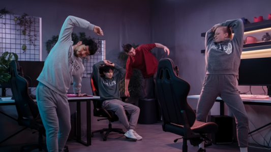 Esports team doing group stretches in gaming room